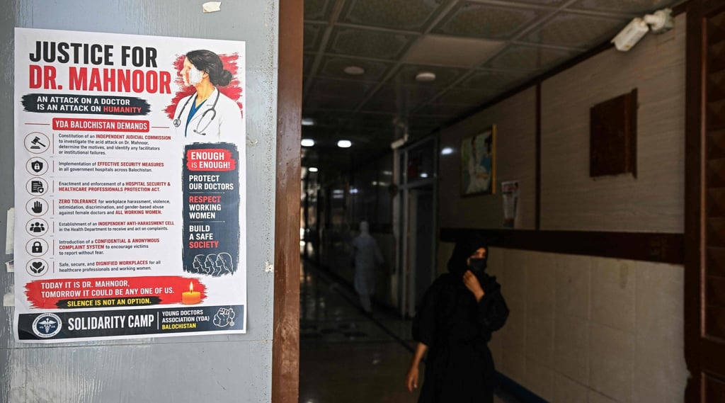 A woman walks past a poster displayed by medical practitioners to express solidarity with Mahnoor Nasir on Tuesday. Photo: AFP A woman walks past a poster displayed by medical practitioners to express solidarity with Mahnoor Nasir on Tuesday. Photo: AFP