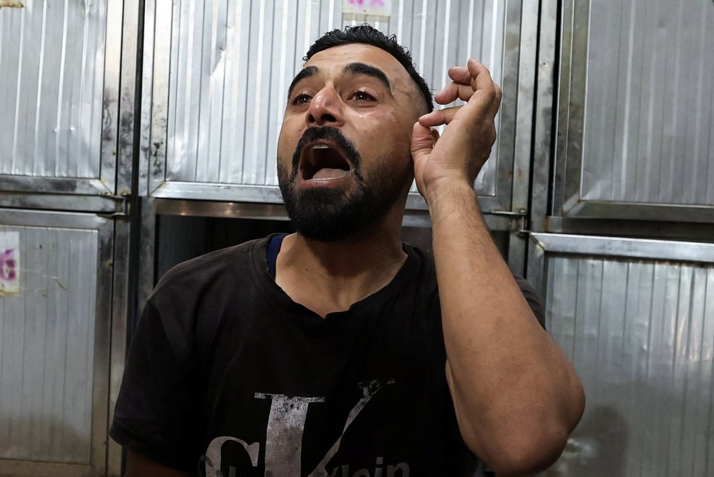 A Palestinian man mourns victims of an Israeli strike at Al-Shifa Hospital in Gaza City on Sunday. Photo: Reuters A Palestinian man mourns victims of an Israeli strike at Al-Shifa Hospital in Gaza City on Sunday. Photo: Reuters